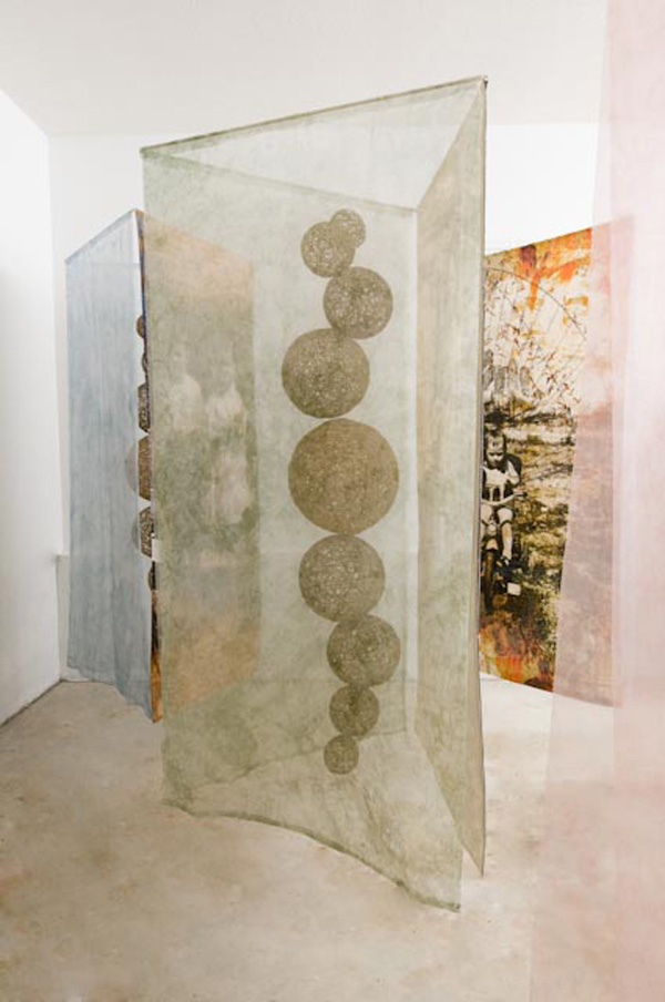 "Vignettes of a Family", (detail) Digitally collaged photographs on cotton muslin, hand embroidered and machine stitched, dyed silk organza, stiffened yarn, 2011.