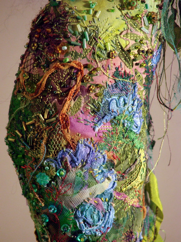 Detail: Wave Dancer, 18" H, cotton cloth, ribbon, beads, ribbon, wooden stand.