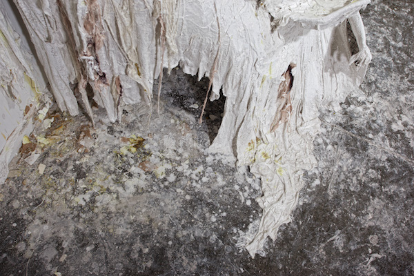 Into the Cut, detail, 2011, 8’H x 15’W, plaster, chicken wire, alpaca wool, gesso, ink, rubber latex. Technique: Cutting directly into the gallery wall, then filling the cracks with plaster & alpaca wool, then creating a three-dimensional armature with chicken wire & plaster. Photo: Josh Band. 