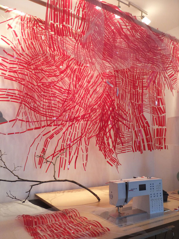 Detail: Flow, machine sewn Rubylith® suspended in front of wall drawing, detail, marker, plastic, tulle, 2012, 15' x 10' x 4' Photo: Christine Mauersberger
 
