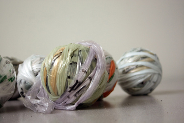 One Day – 48 x 43 x 12 in., Repurposed plastic sleeves from delivered newspapers, handspun and crocheted. Photo by artist