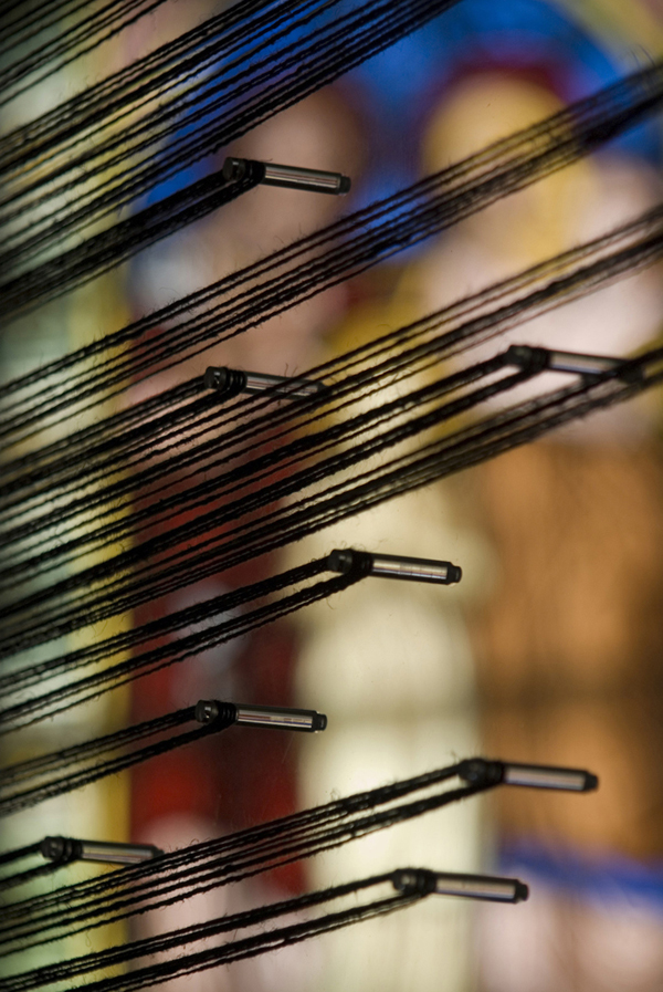 Detail: Transmission, site-specific installation for the Biennale Internationale du Lin, Portneuf, QC. Thread wound around acrylic rods on interconnected laser-cut acrylic panels, hardware, stained glass windows, 2009, 7 1/2"H x 5"W x 1 1/2"D, threading. Photo: Idra Labrie.