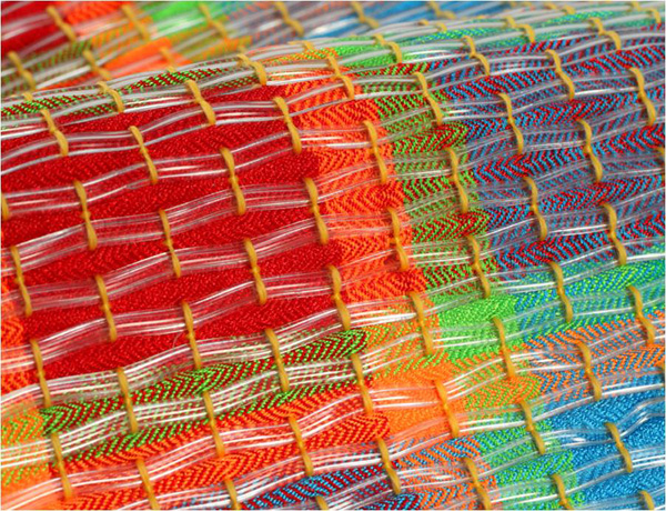 Design Tradition: sample, 2010. Cotton, polyester, wool and plastic tubing. Multi-layered block-weave structure created on a 24 harness compu-dobby loom. Detail: 3 " x 2 ½ " x ¼"