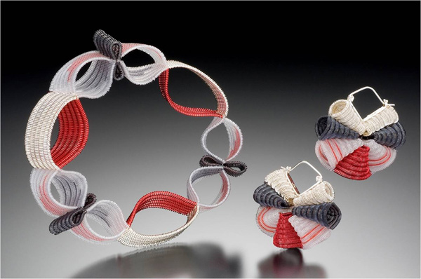 Ribbon Candy, 2007. Fine silver, sterling, copper, color coated copper and nylon monofilament. Double-cloth on 4 harness floor loom. Hand fabricated jewelry components. 4 ½" x 4 ½" x ¾" and 1 ¼" x 1 ½" x ½"
