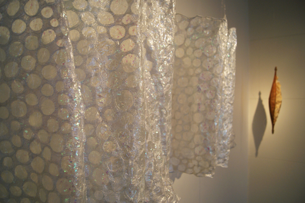 Aquatic Embrace in the "Memento mori" exhibition in the 2012 World of Threads Festival at The Gallery at Sheridan Insitute in Oakville, Ontario. Curated by Gareth Bate. Work in the background by Nancy Yule