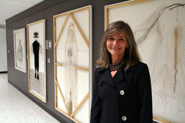 Trina with her work in the 2014 World of Threads Festival.

