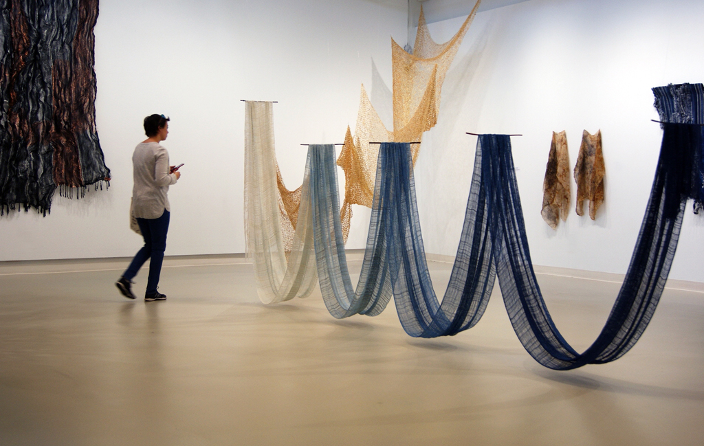 A visitor to the Flow exhibition, World of Threads Festival 2018.