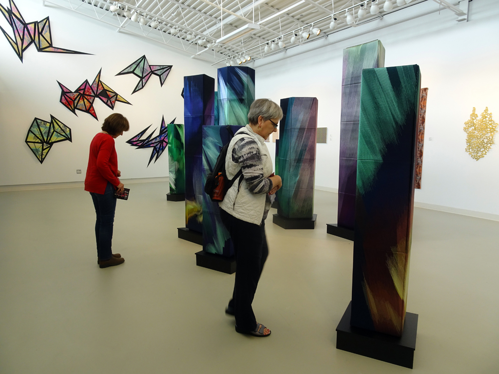 Visitors on an organized tour to the Cosmic Geometry exhibition, World of Threads Festival 2016.