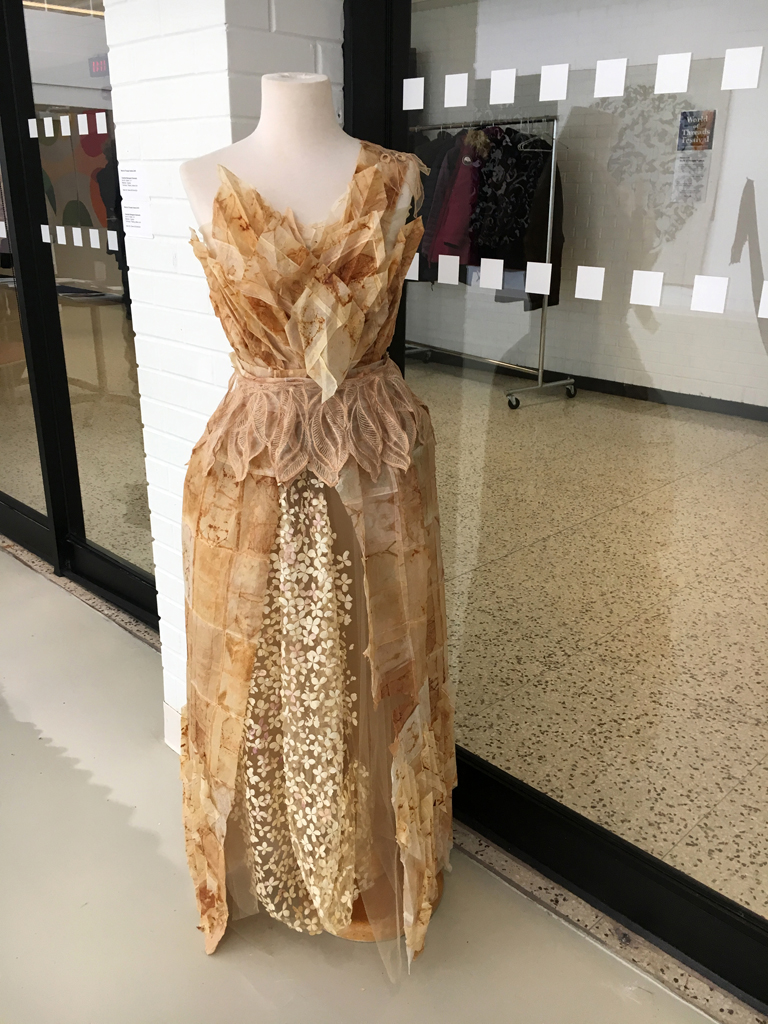 Suzy Martins: Waking Dream Tea Bag Dress, 2018, 74H x 30W x 15D, tea bag papers, hydrangea petals, tulle, lace, thread. Technique: hand stitching and machine sewing.