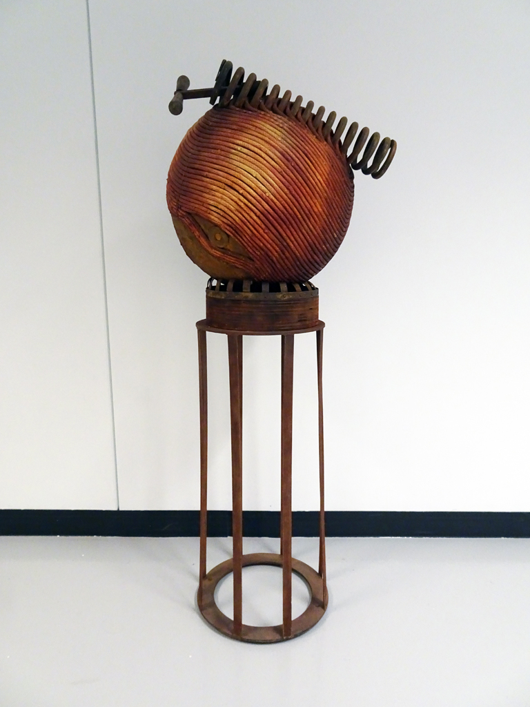 Melanie Chikofsky: Wound Up, 2016, 160.02H x 50.8W x 50.8D, Rope, Patinated Iron Infused, Found Objects, Wood, Metal Base.