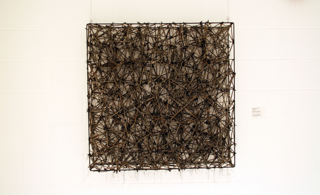 Criss-Cross, 2016, 90cm H x 90 cm W x 15 cm D, Handmade paper from old books, coloured, inside synthetic fabric, knotted with cotton threads, frame in iron.