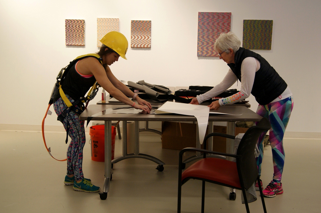 Artist: Heather Macali, Installing her artwork, World of Threads Festival 2016.