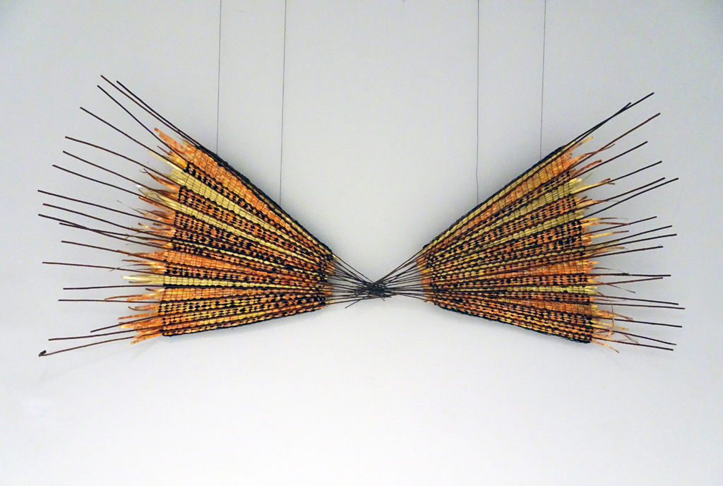Save the Monarch, 2016, 75 H x 190 W x 10 D cm.,  copper wire warp, mixed weft including: brass sheet metal with goldleaf, copper wire, silk, wool and nylon thread and rattan vine. Technique:  Haute-lisse  (aka Vertical or High Warp) Woven tapestry. 