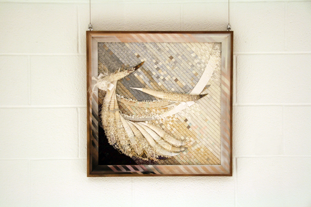 Wind, 2015, 57 H x 57 W x 3 D cm, cardboard, polyurethane foam, mixed thread including: jute, metallic threads, silk, synthetic and wool, Technique: invented by the author (threads winded up around the cardboard and / or polyurethane foam). Framed. 