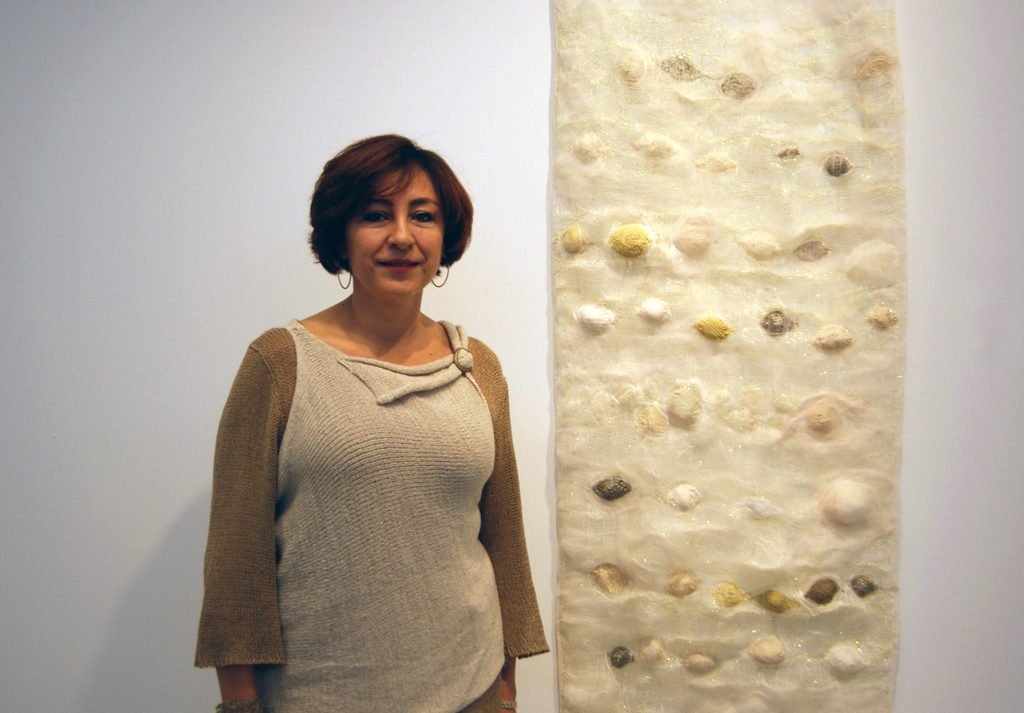 Artist Ixchel Suarez at the Quiet Zone exhibition, World of Threads Festival 2012.
