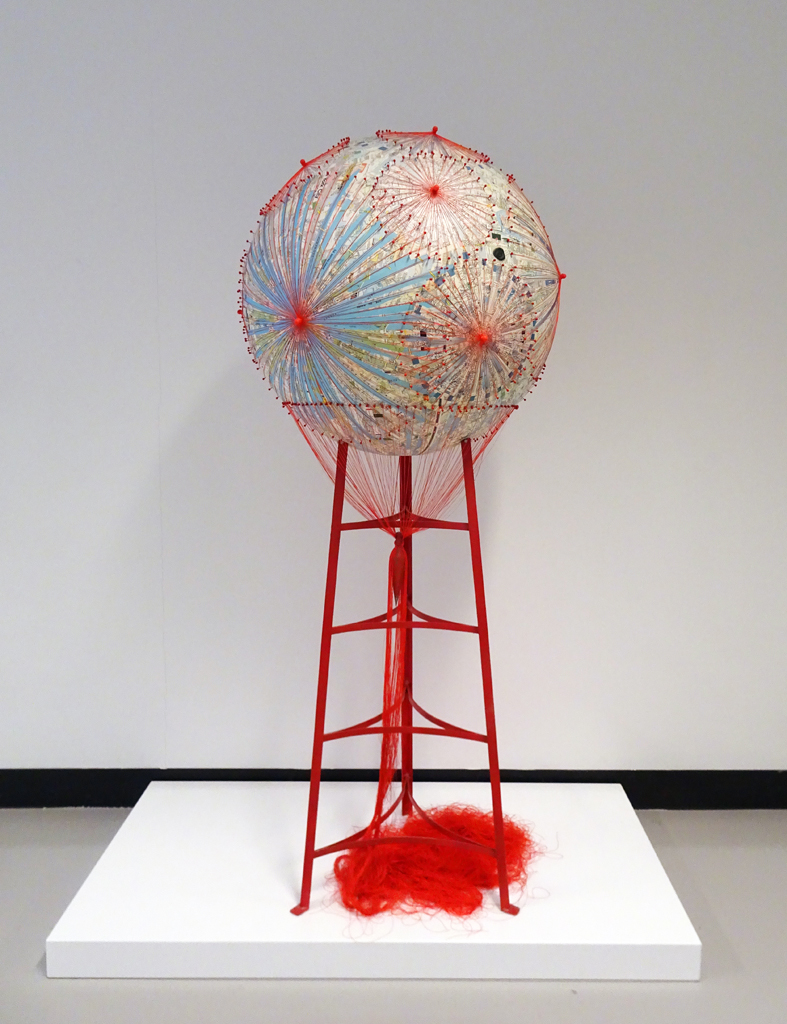 Melanie Chikofsky: Going Round in Circles, 2016, 152.40H x 66.04W x 66.04D, Vintage Maps, Thread, Map Pins, Plumb-Bob, Painted Metal Stand.