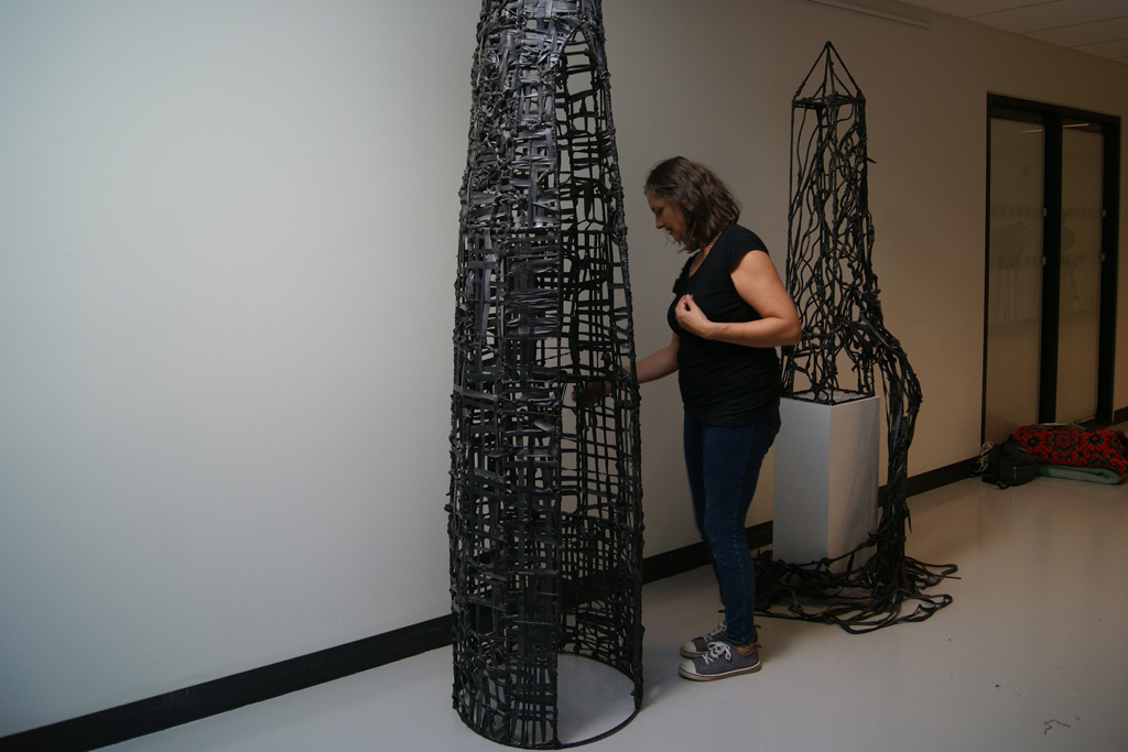 Julia White installing her work, World of Threads Festival 2018.