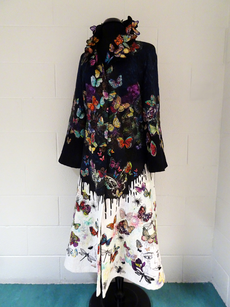 Marijke van Welzen: The Butterfly Effect, 2016, 150H x 100W x 100D cm, coat.
Materials: cotton, lining polyester, fabric paint.
Techniques: Textile collage, applique, thread painting, free motion machine stitching, stenciling, thermofax printing.