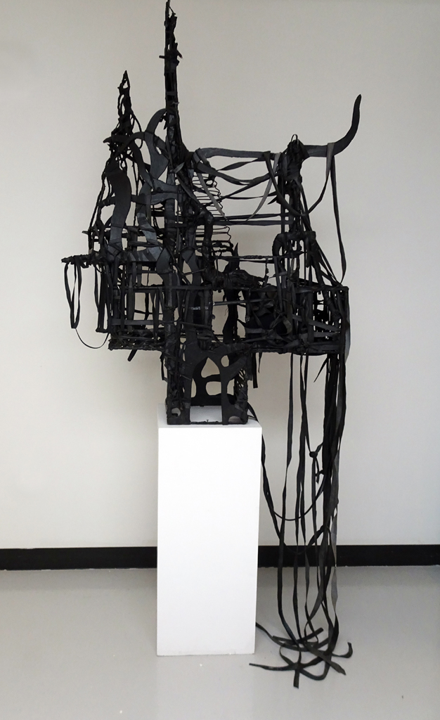 Julia White: WATER Shadows- Water Temple 6, 2016, 88” H x 39” W x 22” D, steel, recycled bicycle inner tubes, masonite, paint, tree root, wood, textiles, twines. Technique: free-form weaving, knotting, wrapping. Free-standing.