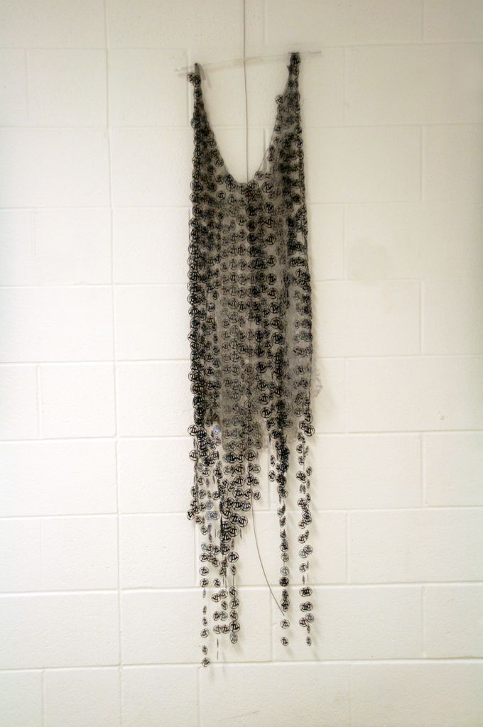 Women in War for Peace, 2015. Materials: X-Rays, reflective material and flat yarn of 1,5mm; nylon thread. Technique: Hand knitting, numerical treatment of tsubas for laser engraving and cutting on X-Rays; hand and machine sewing.Technique : X RAYS cut and sewn together with different kind of threads. Photo : Brigitte Amargar.