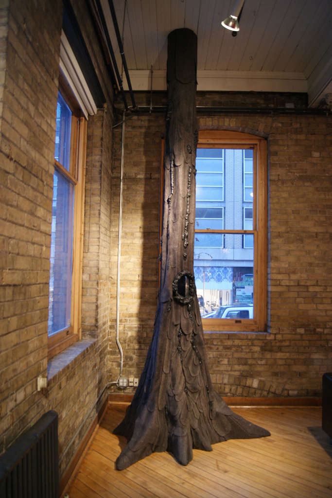 Cycles of Life, main trunk approx. 24" diameter & 13' tall. Felt, wire  and wood, reaching from floor to ceiling. The felt trunk, root and branches are sewn, frayed, painted, and cut to obtain the texture of wood bark. 