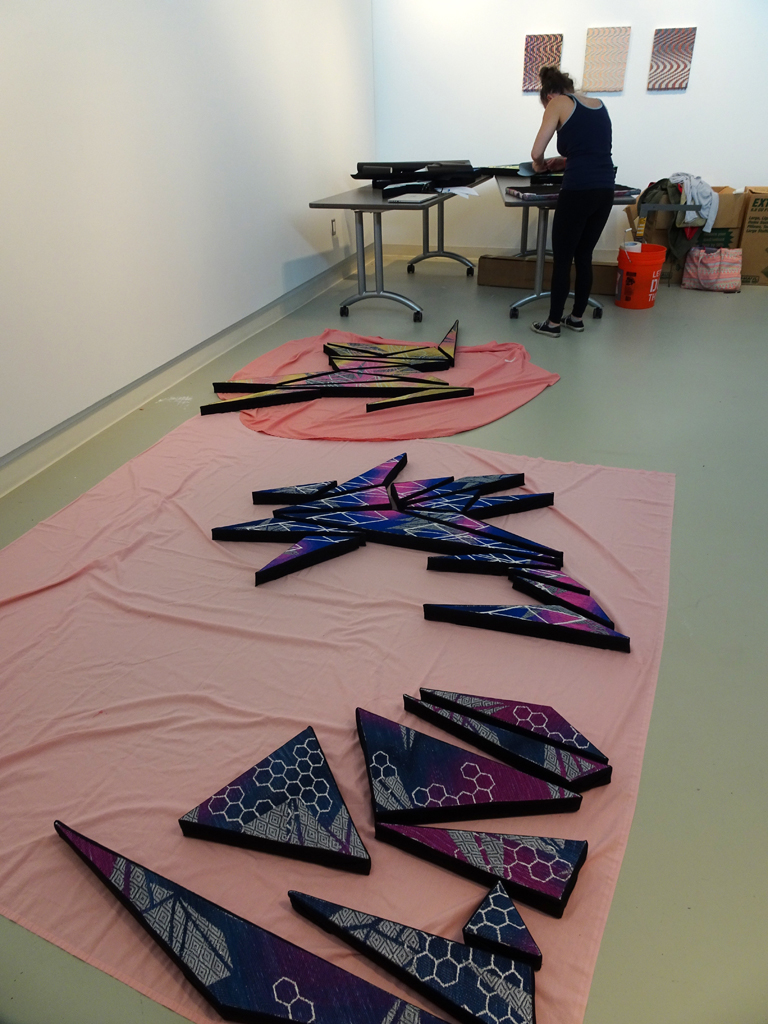 Artist: Heather Macali, Installing her artwork, World of Threads Festival 2016.