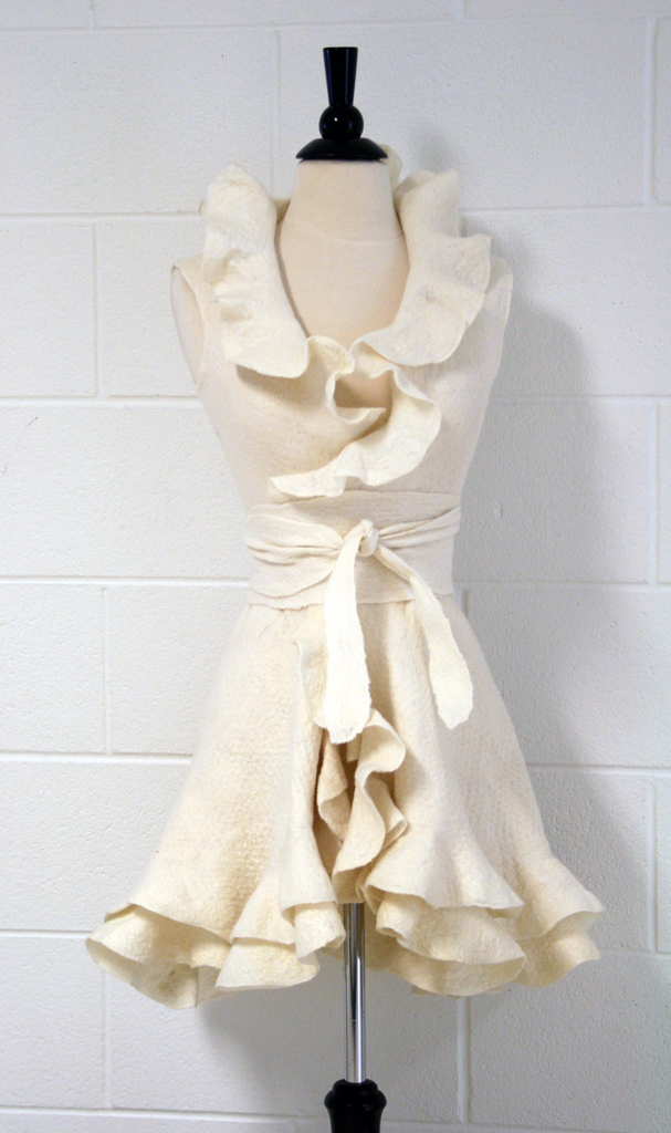 Intentions, April 2016, 44”x 21”x 7.5 (waist depth)”, Merino wool, tussah silk, handwoven belt- assorted yarns, Technique: wet-felted, hand woven. Photo Credit: Drew Gilbert. 