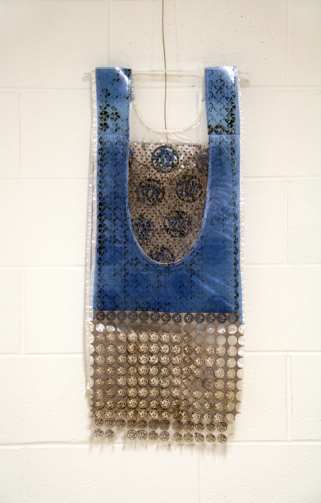 Women in War for Peace, 2015. Materials: X-Rays, reflective material and flat yarn of 1,5mm; nylon thread. Technique: Hand knitting, numerical treatment of tsubas for laser engraving and cutting on X-Rays; hand and machine sewing.Technique : X RAYS cut and sewn together with different kind of threads. Photo : Brigitte Amargar.