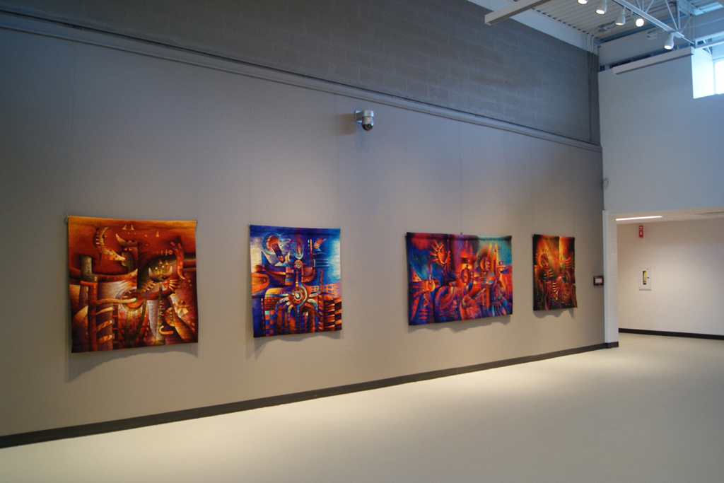 Installation view, tapestries by Maximo Laura.