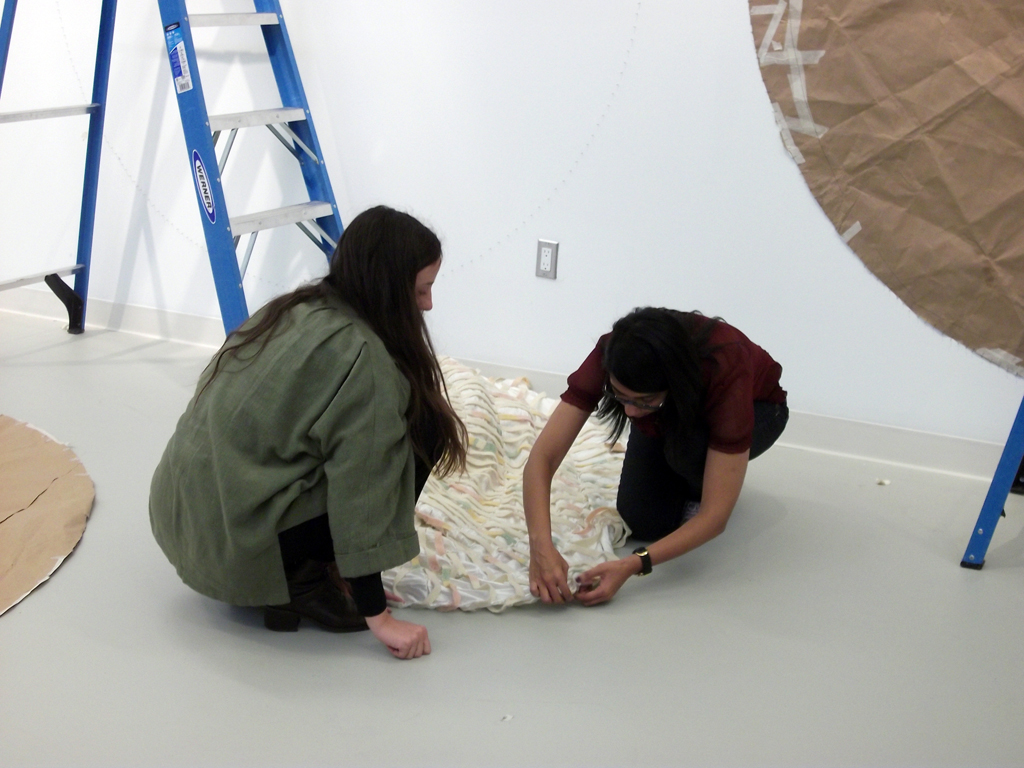 Starting to install the work of Lisa DiQuinsio, under her supervision.