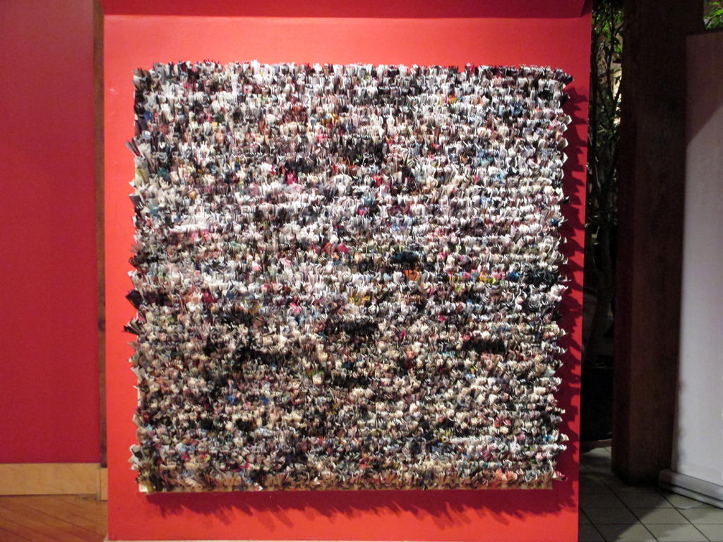 Flare, 2011, (152.4cm x 152.4cm x 12.7cm), pages from Flare magazines, twine, staples, wooden stretcher, Technique: rag rug.