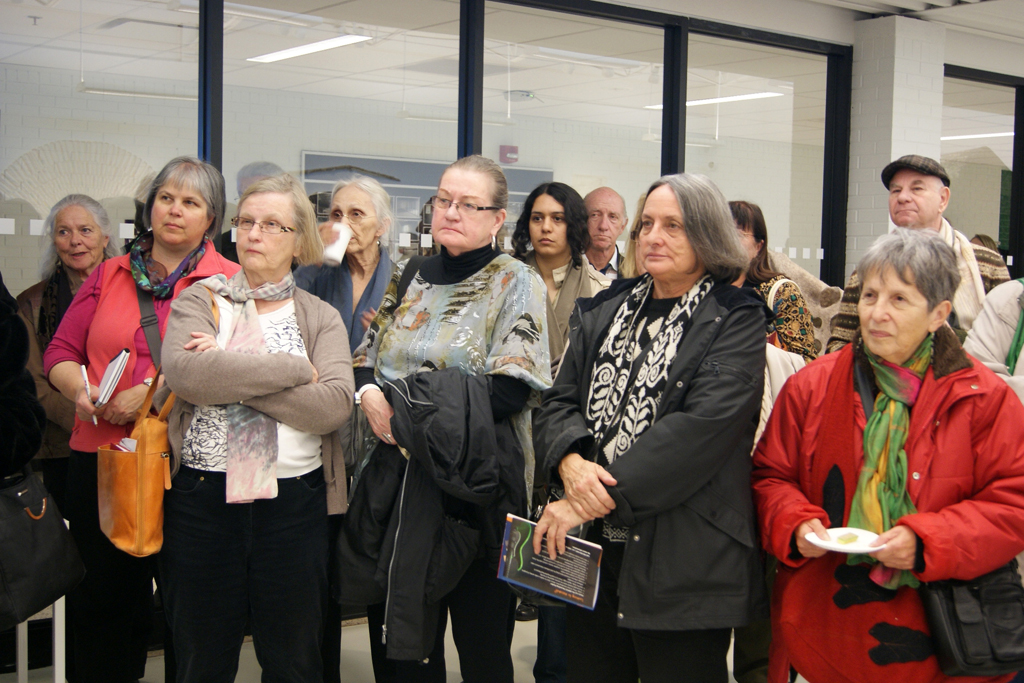 Artists and visitors at the Quiet Zone exhibition, World of Threads Festival opening reception.