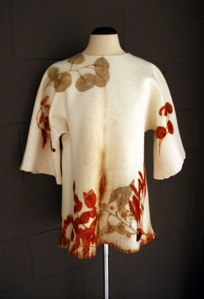 Vinitha Sara John: Botanically Inspired tunic, November 2017, Size 6. This seamless felted pullover tunic is made from superfine Italian merino and Uzbek silk using the nuno felting technique. Then eucalyptus leaves are laid on the coat, tied into bundle and steamed. The heat helps the leaves release their pigments onto the felt.