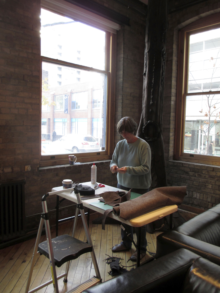 Lynn Kelly installing her work.