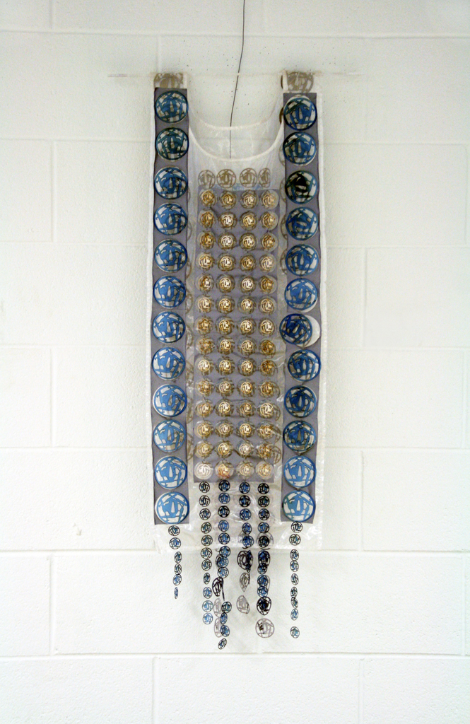 Women in War for Peace, 2015. Materials: X-Rays, reflective material and flat yarn of 1,5mm; nylon thread. Technique: Hand knitting, numerical treatment of tsubas for laser engraving and cutting on X-Rays; hand and machine sewing.Technique : X RAYS cut and sewn together with different kind of threads. Photo : Brigitte Amargar.