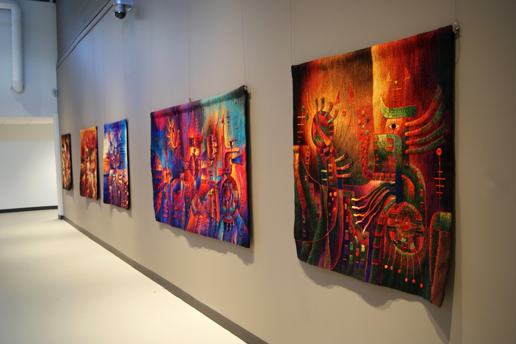 Installation view of tapestries by Maximo Laura.