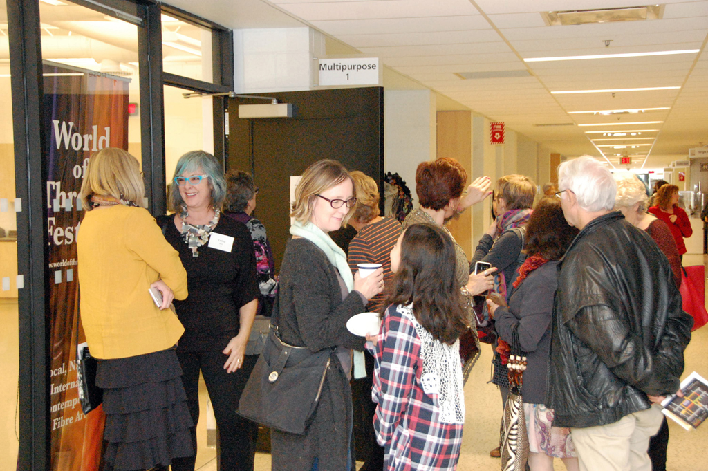 Artists and visitors mingling, World of Threads Festival 2018.