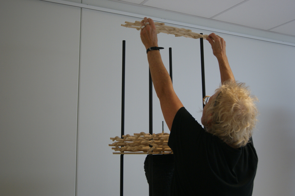 Eva Ennist installing her work, World of Threads Festival 2018.