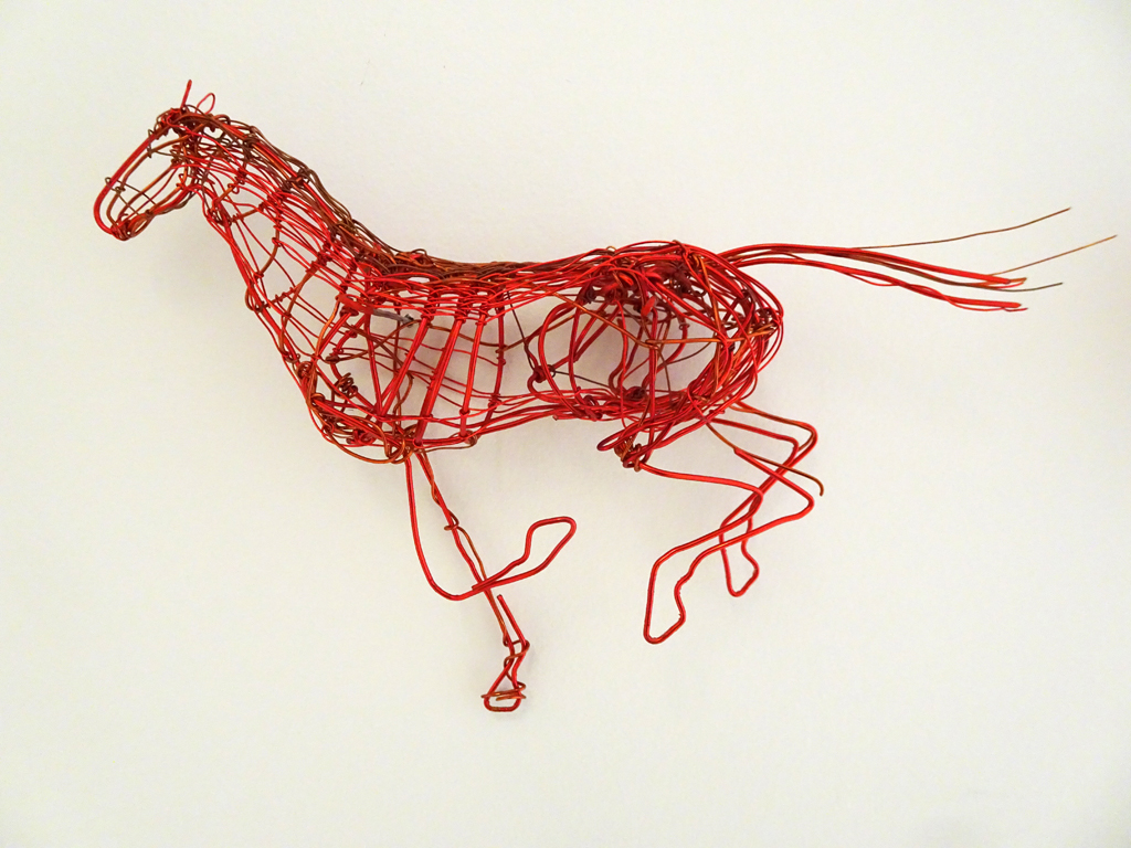Anna Lefstud: One Full Stride, 2018.
This wall work consists of 24 copper wire horses, each approximately 9”x 5”.  Lined up, they stretch to approximately 19’, and sequentially depict one stride of a horse in full run.
