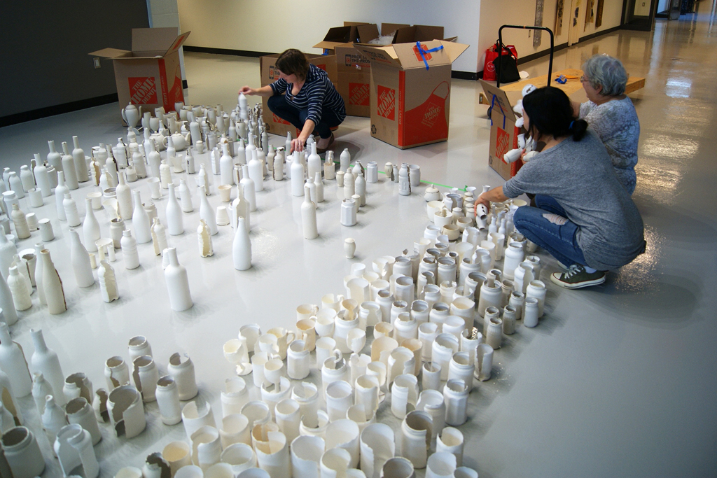 Opening and unwrapping the art pieces.