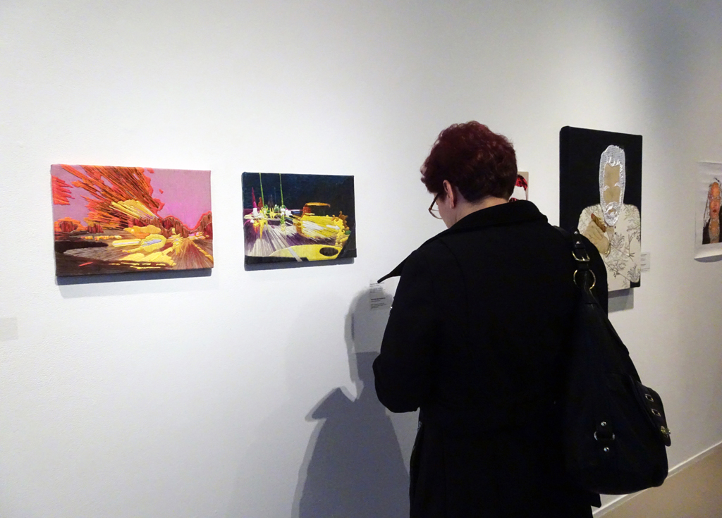 A visitor at the opening of the "me and you" exhibition, World of Threads Festival 2016.