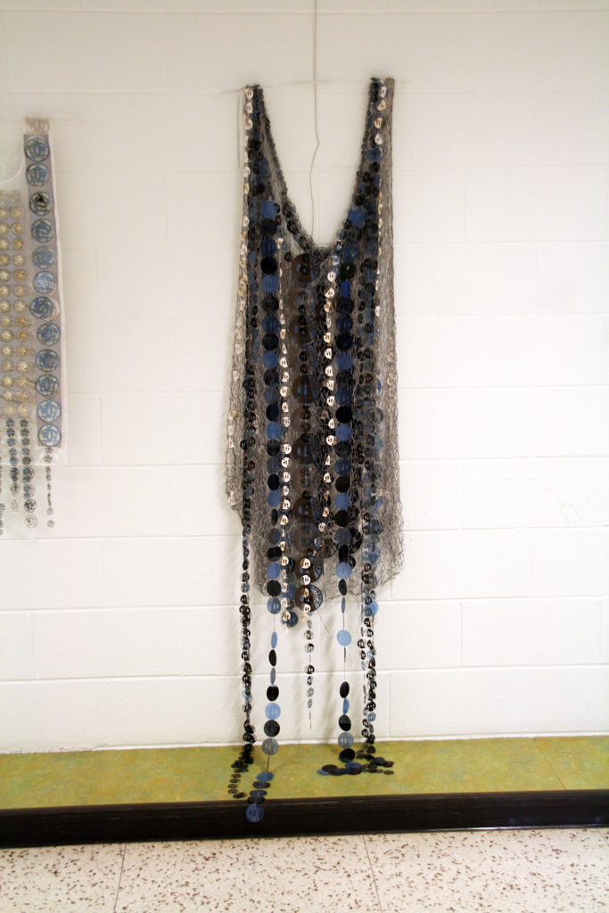 Women in War for Peace, 2015. Materials: X-Rays, reflective material and flat yarn of 1,5mm; nylon thread. Technique: Hand knitting, numerical treatment of tsubas for laser engraving and cutting on X-Rays; hand and machine sewing.Technique : X RAYS cut and sewn together with different kind of threads. Photo : Brigitte Amargar.