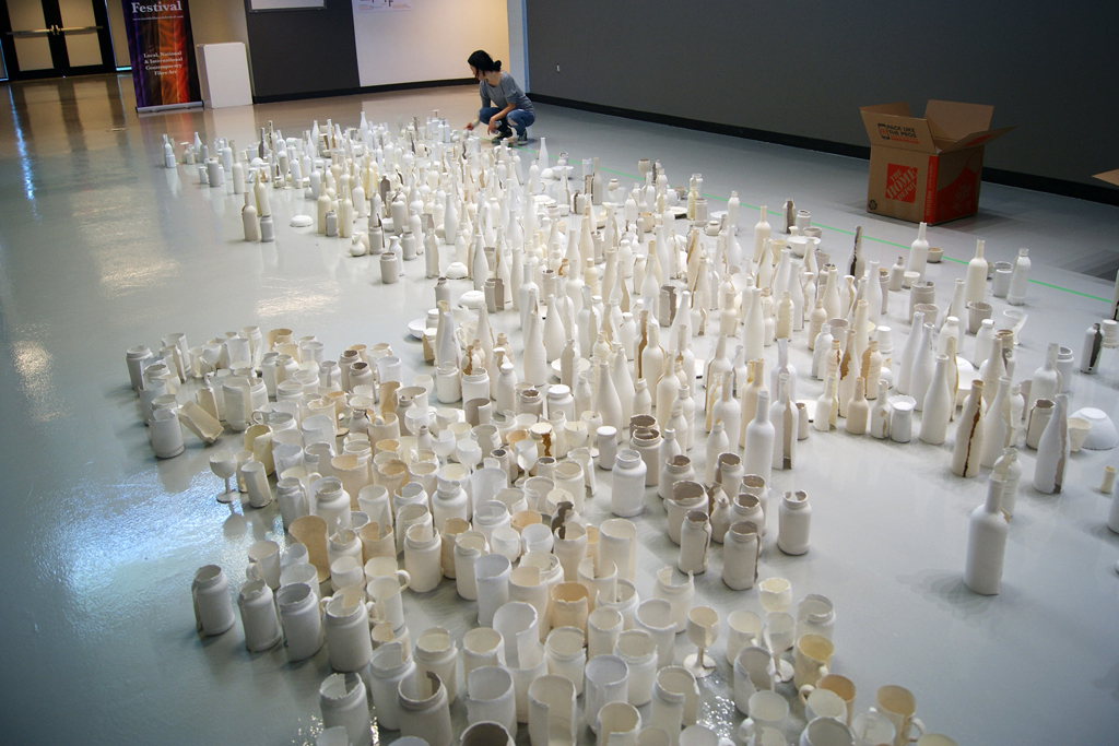 Sun Young Kang installing her massive floor installation.