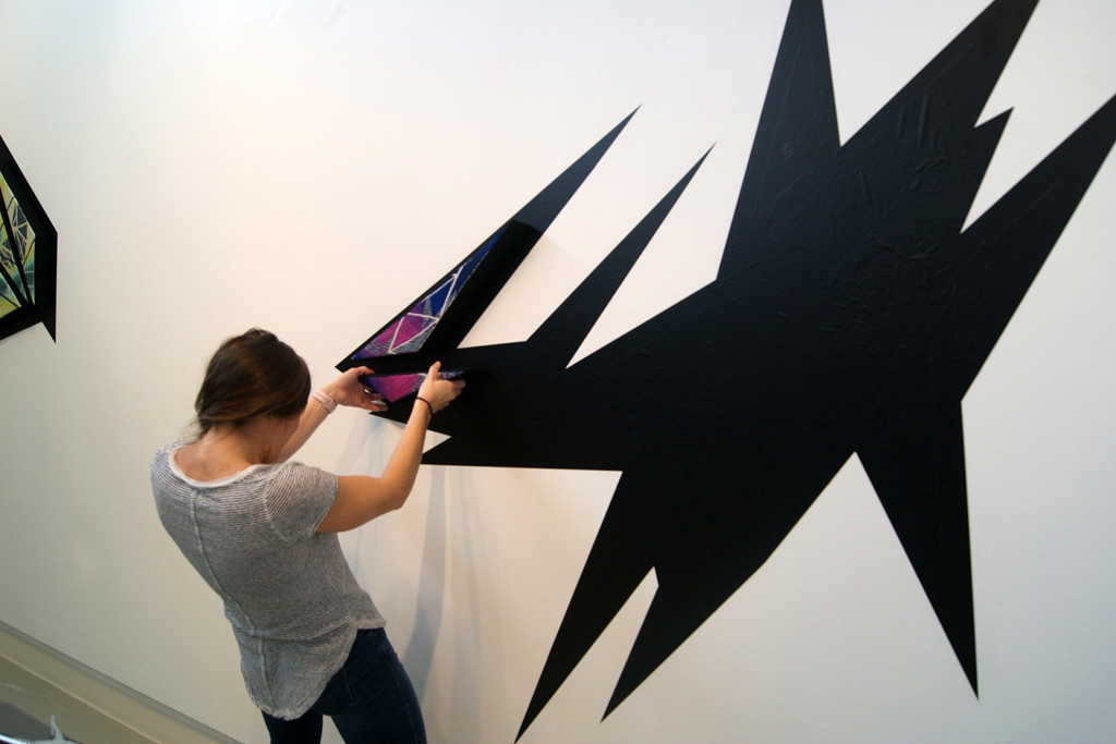 Artist: Heather Macali, Installing her artwork, World of Threads Festival 2016.