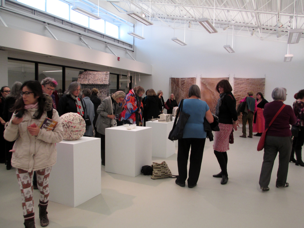 Visitors at the opening of the Quiet Zone exhibition, World of Threads Festival 2012.