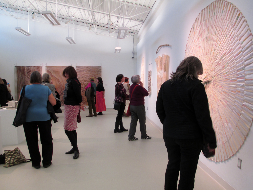 Visitors at the opening of the Quiet Zone exhibition, World of Threads Festival 2012.