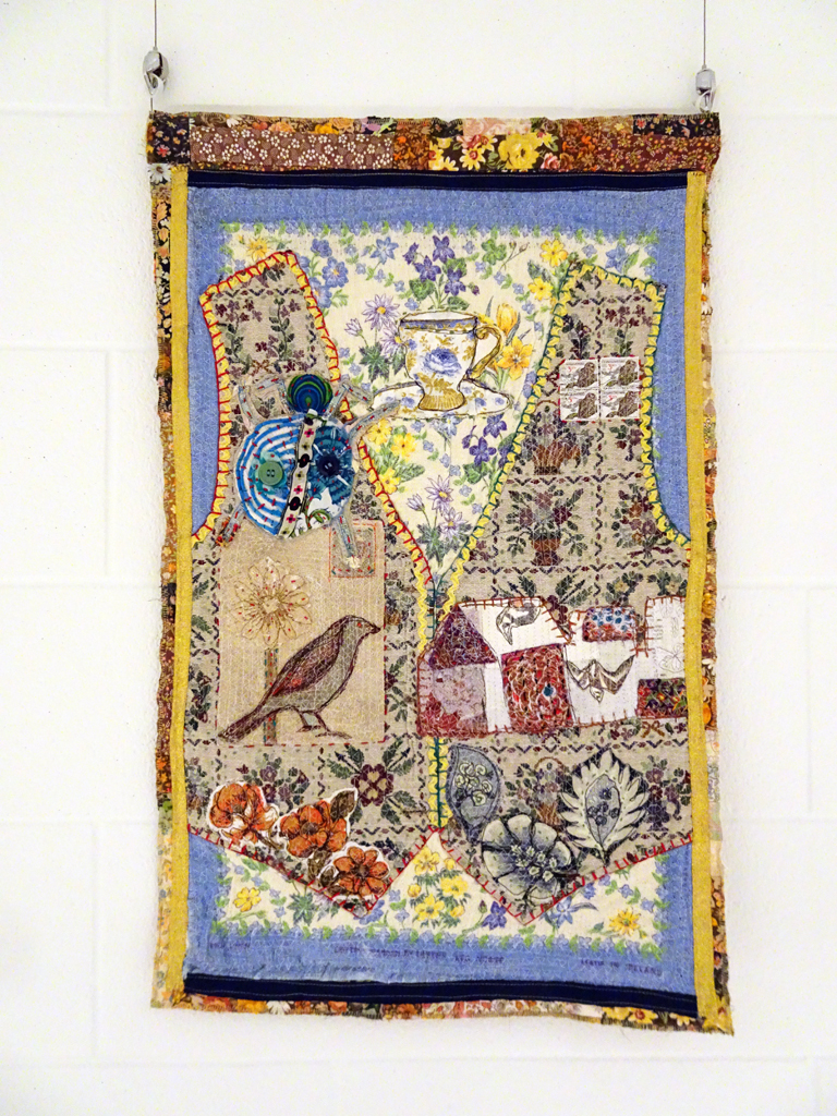 Judy Martin: Folk Waistcoat 1, 2016, 80 x 60 x .4cm, Vintage waistcoat, tea towel, cotton, linen and coated paper elements, fabric collage inserts, Technique: textile collage using hand and machine stitching.