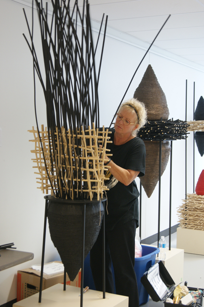 Eva Ennist installing her work, World of Threads Festival 2018.