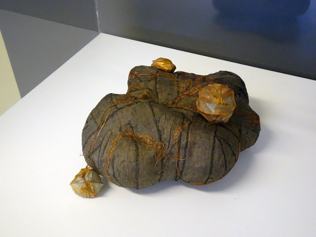 Tailings 1, is based on the horrific beauty of mining tailings- detritus left after separating the valuable from the worthless. Often toxic, they are eerily beautiful with strange colors & shapes. Using my recycled and extracted “art” tailings and experiments to construct sculpture from what might be considered waste.