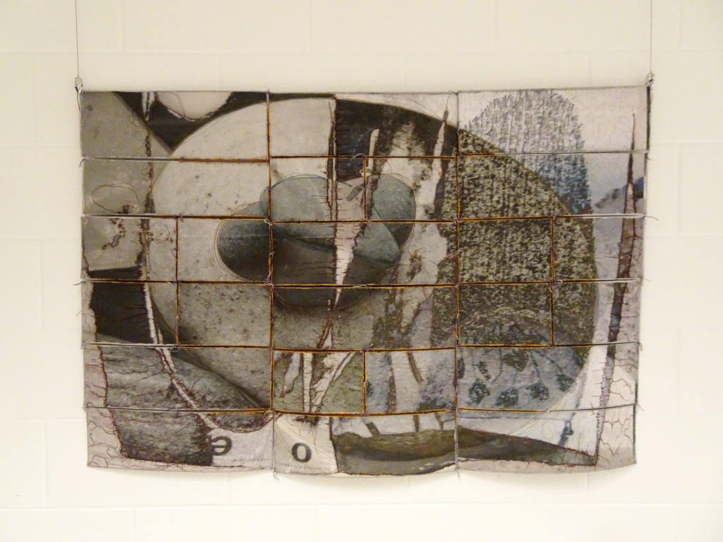 Wen Redmond: Rocks Are Smiling, art is timeless, 32x48
Mediu: Digital Fiber -ink jet treated digital canvas, dyed pearl cotton, UV medium and paint. 
Technique- A creative aspect of digital photography is creating an image using the 21st century tool, Photoshop, programs or applications. 
Several photographs are fused digitally and printed. The fiber photograph was mounted onto free sections and quilted with colored threads for design emphasis and hand-tied. Edges and top are sealed.